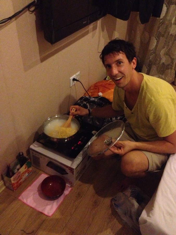 Cooking away on our hot plate in our hotel room.